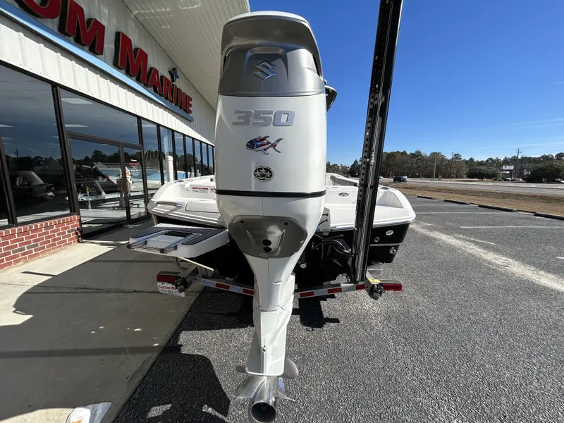 Slide: The Image of 2022 Crevalle 26 HCO boat with Suzuki 350 outboard motor at a dealership. - 47