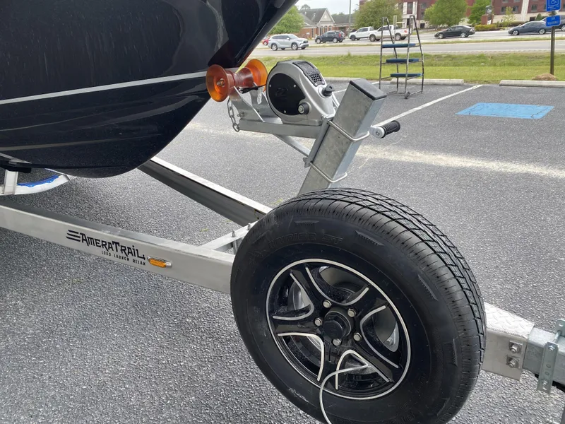 Slide: The Image of 2022 Crevalle 26 HCO boat on AmeraTrail trailer, close-up of wheel and hitch. - 6