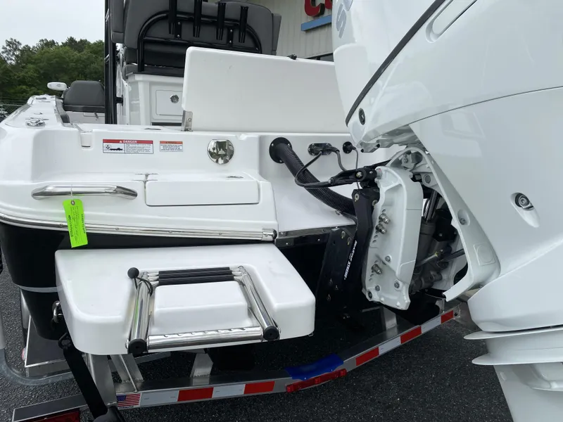 Slide: The Image of 2022 Crevalle 26 HCO boat with outboard motor and swim ladder. - 9