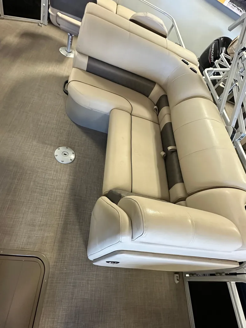 Slide: The Image of 2022 Sun Tracker SportFish 22 XP3 boat interior with beige seating. - 5