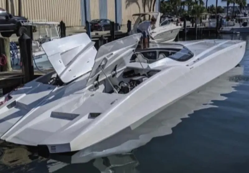 Slide: The Image of 2016 MTI 52' Pleasure boat docked at marina with open hatches. - 11