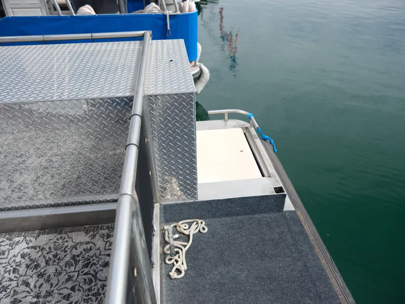 Slide: The Image of 1999 Custom 55x14 Stainless Houseboat deck with railing and water view - 15