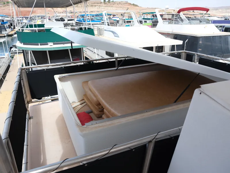 Slide: The Image of 1999 Custom 55x14 Stainless Houseboat with storage compartment on deck. - 19