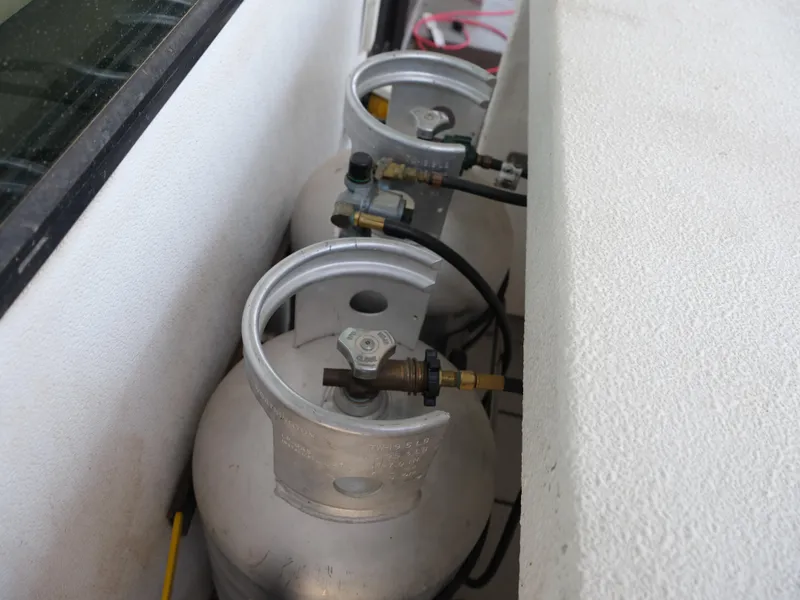 Slide: The Image of Propane tanks on a 1999 Custom 55x14 Stainless Houseboat. - 23