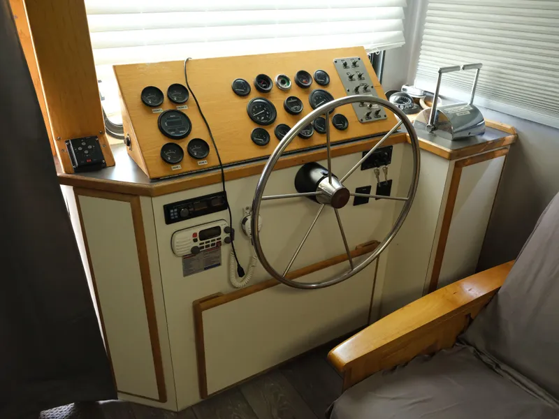 Slide: The Image of Control panel of a 1999 Custom 55x14 Stainless Houseboat. - 25