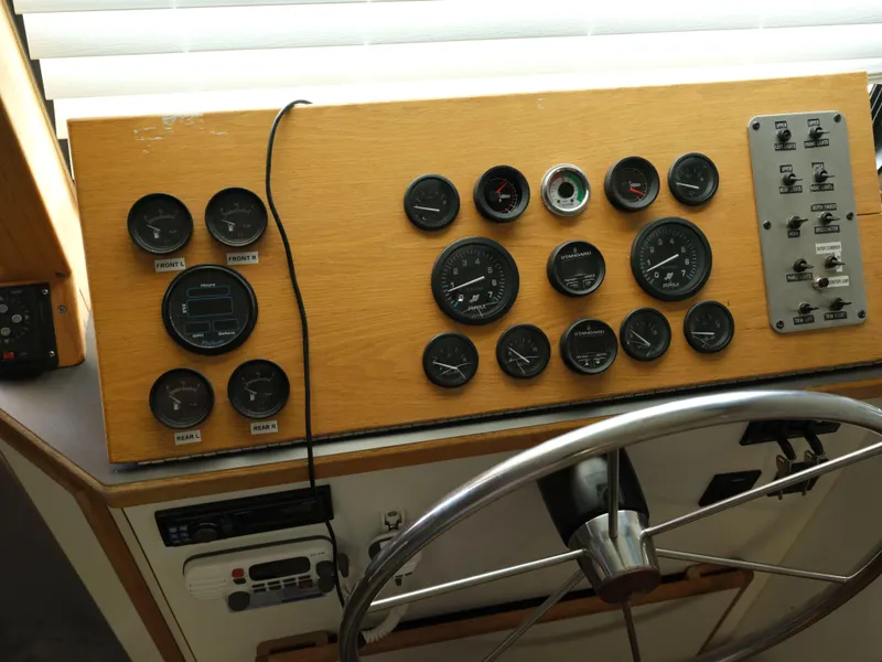 Slide: The Image of Control panel of a 1999 Custom 55x14 Stainless Houseboat. - 26