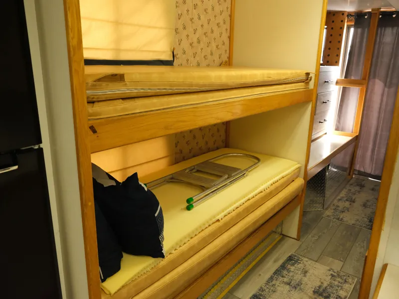 Slide: The Image of Bunk beds in a 1999 Custom 55x14 Stainless Houseboat interior. - 29