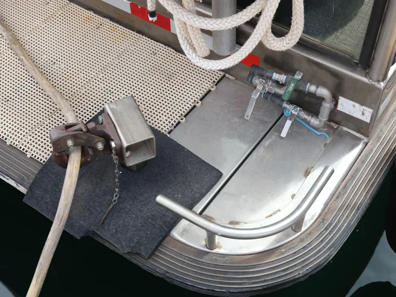 Slide: The Image of 1999 Custom 55x14 Stainless Houseboat stern with mooring equipment and water connections. - 34