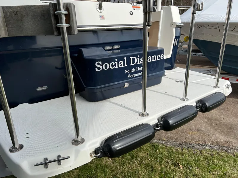 Slide: The Image of 2013 Ranger Tugs R-27 boat named "Social Distance" docked in South Hero, Vermont. - 17
