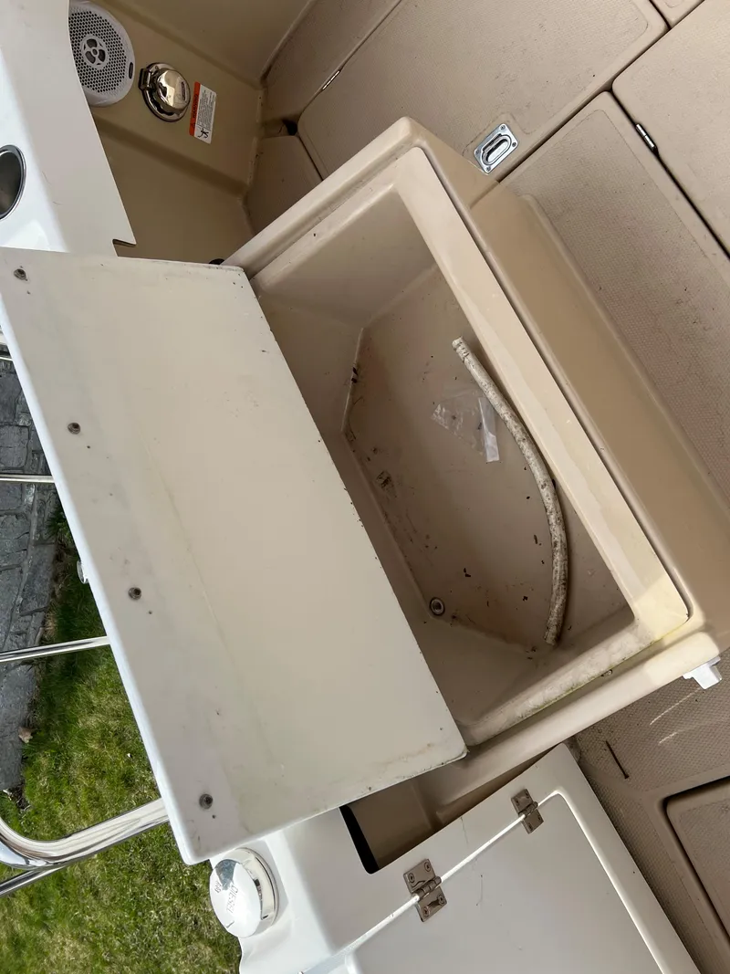 Slide: The Image of Open storage compartment on 2013 Ranger Tugs R-27 boat. - 27