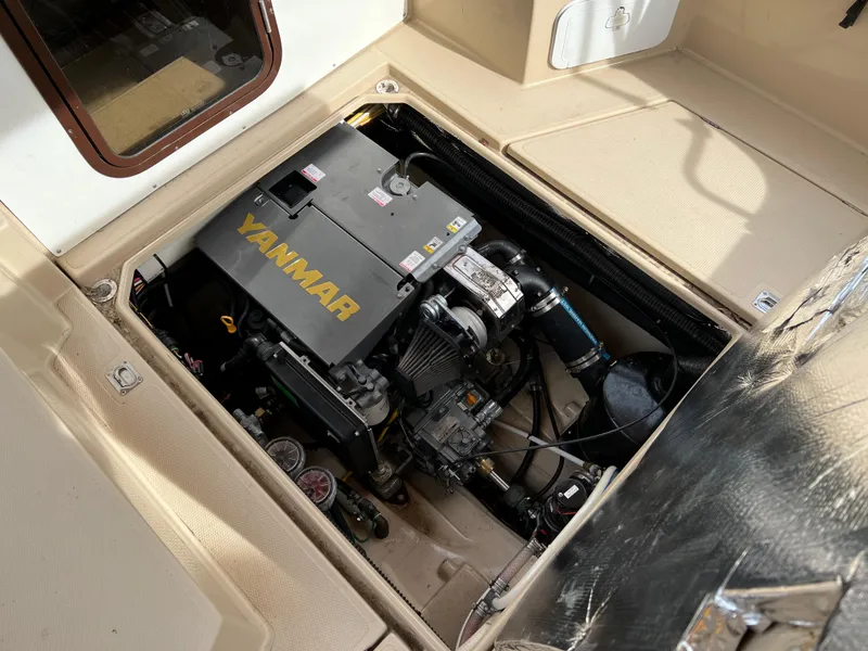 Slide: The Image of 2013 Ranger Tugs R-27 engine compartment with Yanmar engine visible. - 30