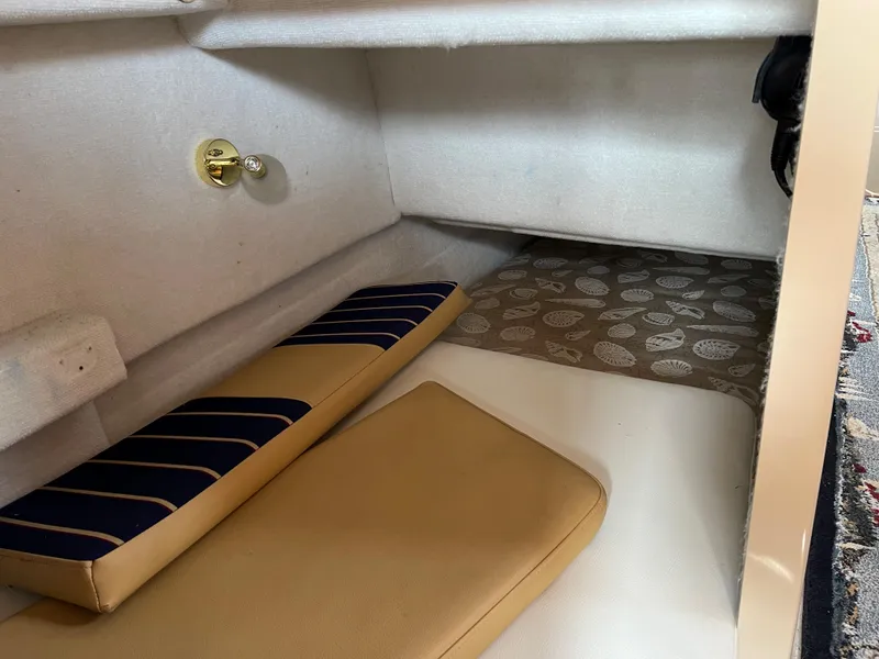 Slide: The Image of Interior cabin of 2013 Ranger Tugs R-27 with cushions and patterned flooring. - 39