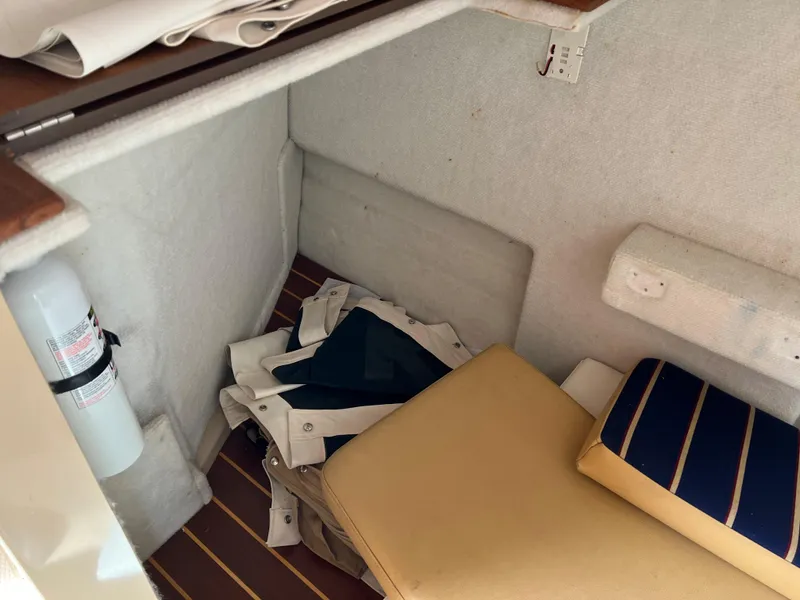 Slide: The Image of Interior cabin of 2013 Ranger Tugs R-27 with cushions and storage area. - 40