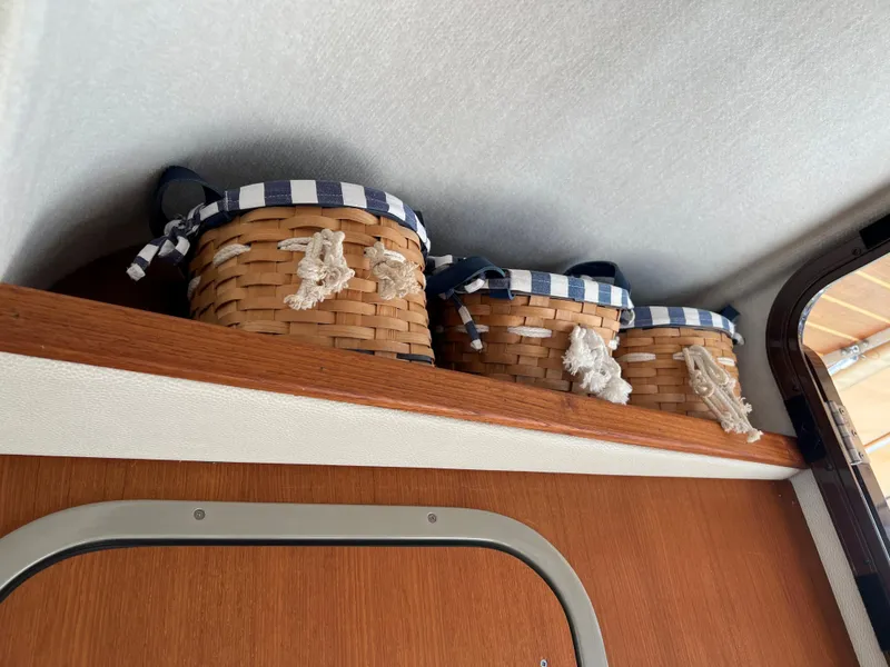 Slide: The Image of Wicker baskets with striped fabric on Ranger Tugs R-27, 2013 interior shelf. - 54