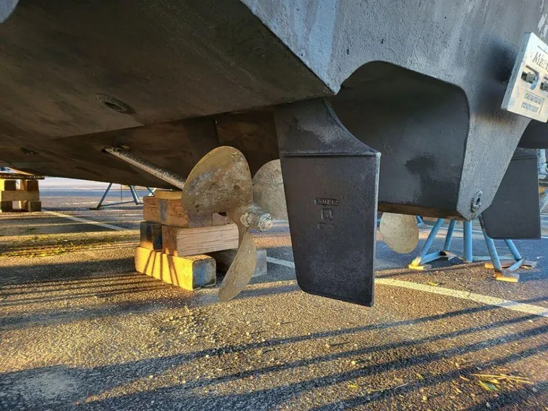 Slide: The Image of Propeller and rudder of a 2005 Sea Ray 320 Sundancer boat on dry dock. - 31