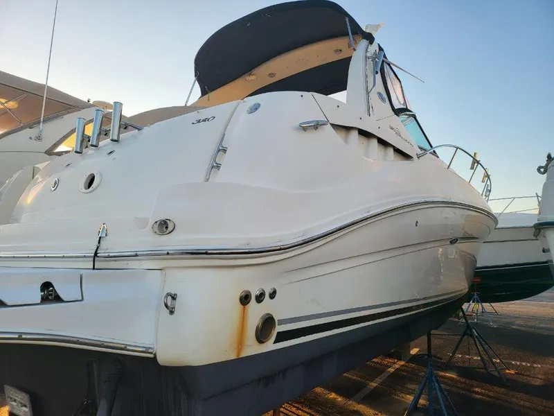 Slide: The Image of 2005 Sea Ray 320 Sundancer boat on dry dock, rear view. - 35