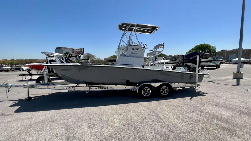 Slide: The Image of 2023 Dargel KAT 250 DX boat on a trailer in a parking lot. - 1