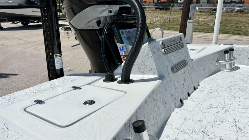 Slide: The Image of 2023 Dargel KAT 250 DX boat deck with motor and storage compartments. - 13