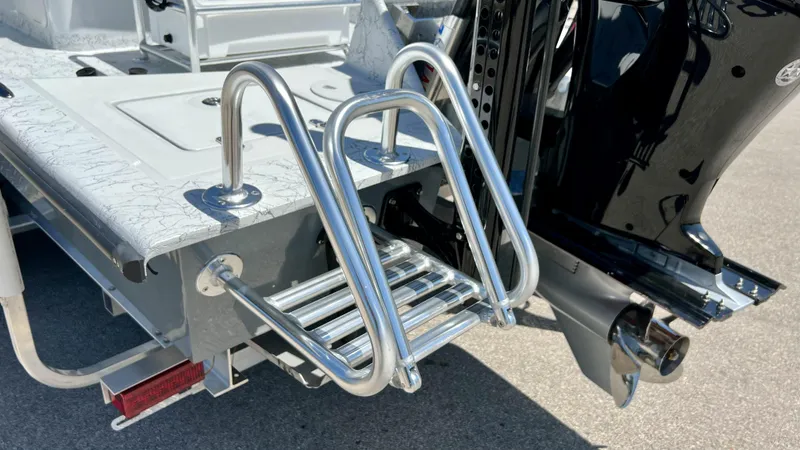 Slide: The Image of 2023 Dargel KAT 250 DX boat with stainless steel swim ladder and outboard motor. - 16