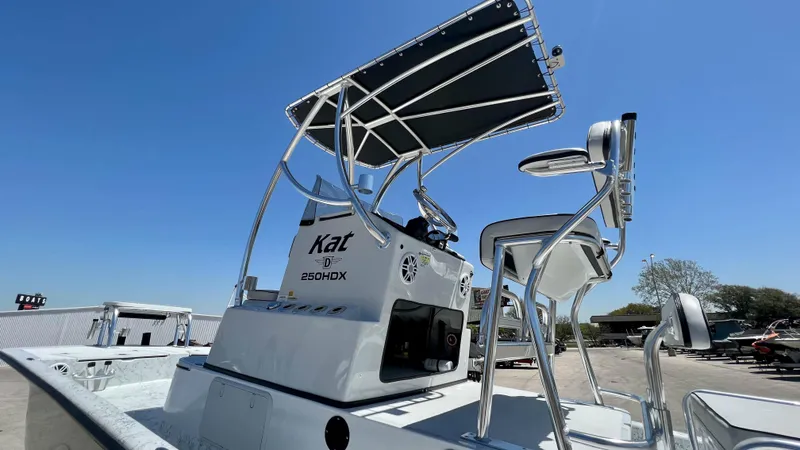 Slide: The Image of 2023 Dargel KAT 250 DX boat with T-top and dual helm seats. - 19