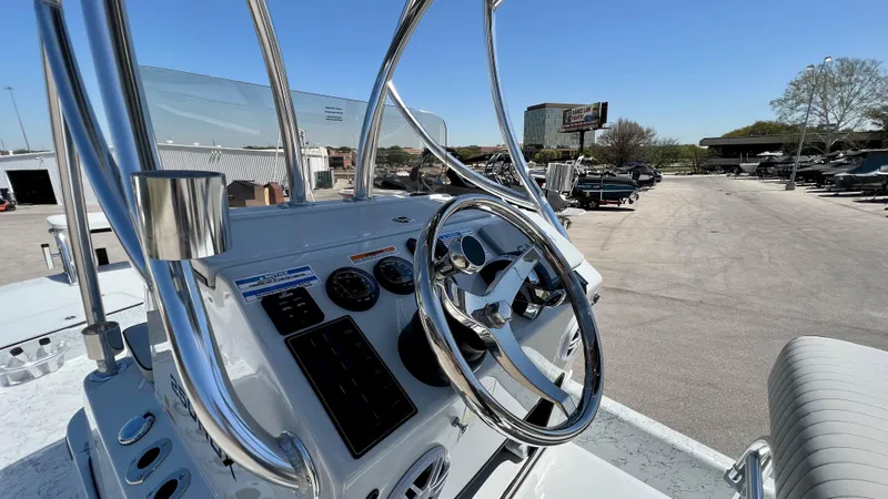 Slide: The Image of 2023 Dargel KAT 250 DX boat dashboard with steering wheel and controls. - 21