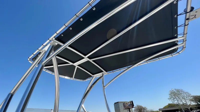 Slide: The Image of 2023 Dargel KAT 250 DX boat canopy under clear blue sky. - 22