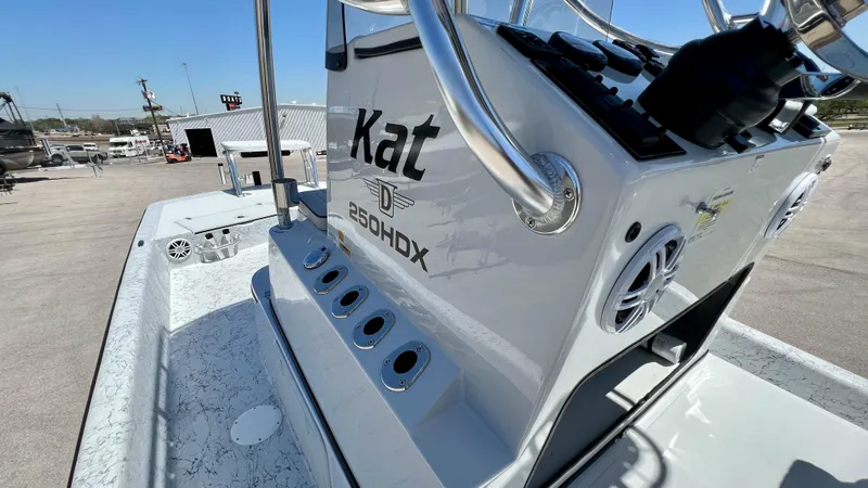 Slide: The Image of 2023 Dargel KAT 250 DX boat console with rod holders and steering wheel. - 23