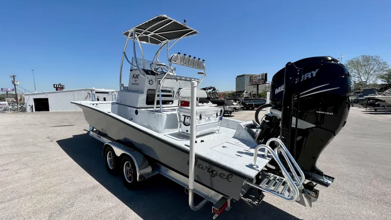 Slide: The Image of 2023 Dargel KAT 250 DX boat with Mercury outboard motor on trailer. - 3