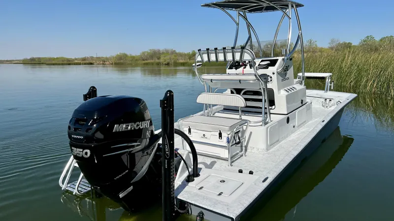 Slide: The Image of 2023 Dargel KAT 250 DX boat with Mercury 250 engine on calm water. - 38