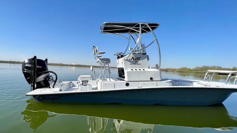 Slide: The Image of 2023 Dargel KAT 250 DX boat on calm water with clear blue sky. - 42