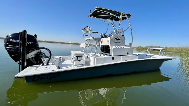 Slide: The Image of 2023 Dargel KAT 250 DX boat on calm water with Mercury outboard motor. - 47