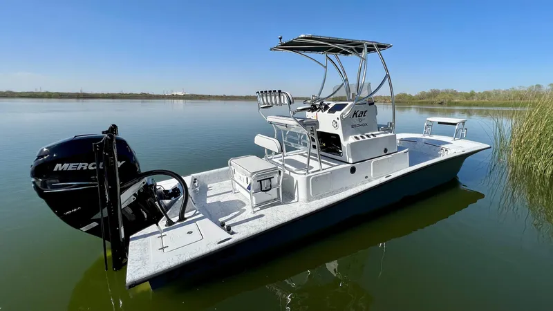 Slide: The Image of 2023 Dargel KAT 250 DX boat on calm water with Mercury outboard motor. - 48