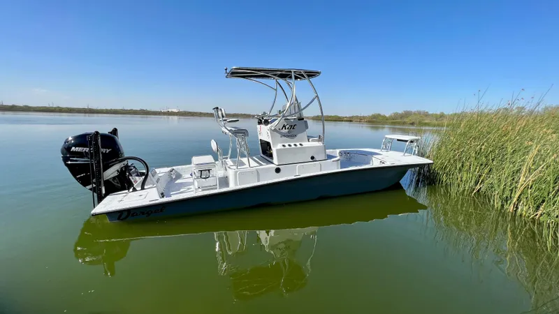 Slide: The Image of 2023 Dargel KAT 250 DX boat on calm water near reeds. - 49