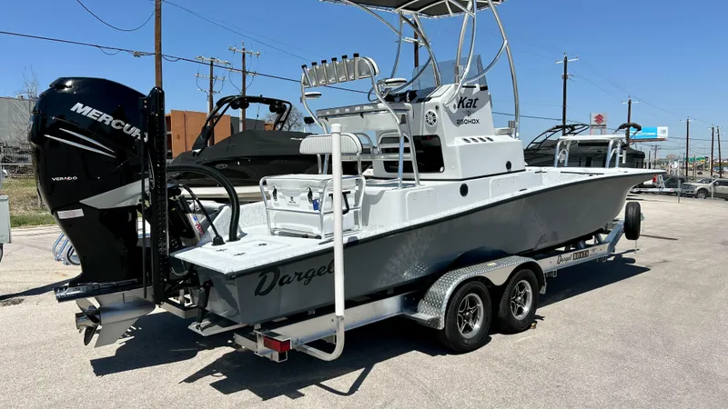 Slide: The Image of 2023 Dargel KAT 250 DX boat on trailer, rear view, with Mercury outboard motor. - 5