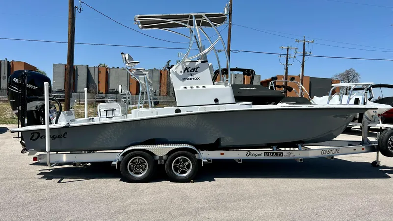 Slide: The Image of 2023 Dargel KAT 250 DX boat on a trailer in a parking lot. - 6