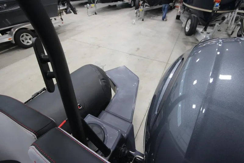 Slide: The Image of 2023 Zodiac Open 5.5 PVC T-Top 115hp boat interior in showroom. - 4