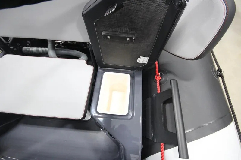 Slide: The Image of 2023 Zodiac Open 5.5 PVC T-Top 115hp boat interior storage compartment. - 8