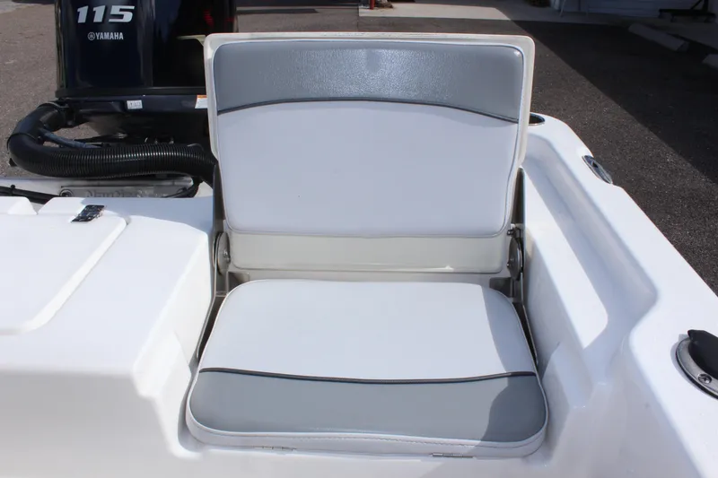 Slide: The Image of NauticStar 195 XTS 2022 boat seat with Yamaha 115 engine in background. - 12