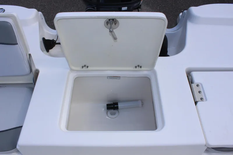 Slide: The Image of Open storage compartment on 2022 NauticStar 195 XTS boat. - 15