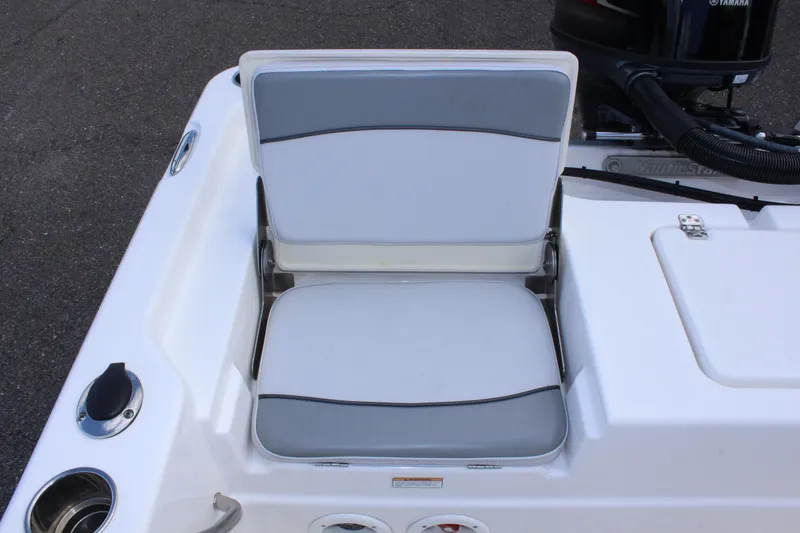 Slide: The Image of 2022 NauticStar 195 XTS boat seat with gray and white upholstery. - 16