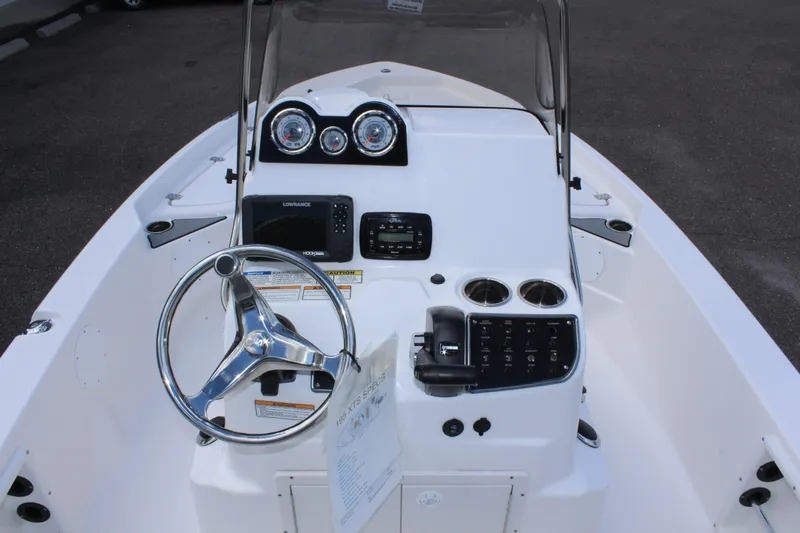 Slide: The Image of 2022 NauticStar 195 XTS boat console with steering wheel and gauges. - 19