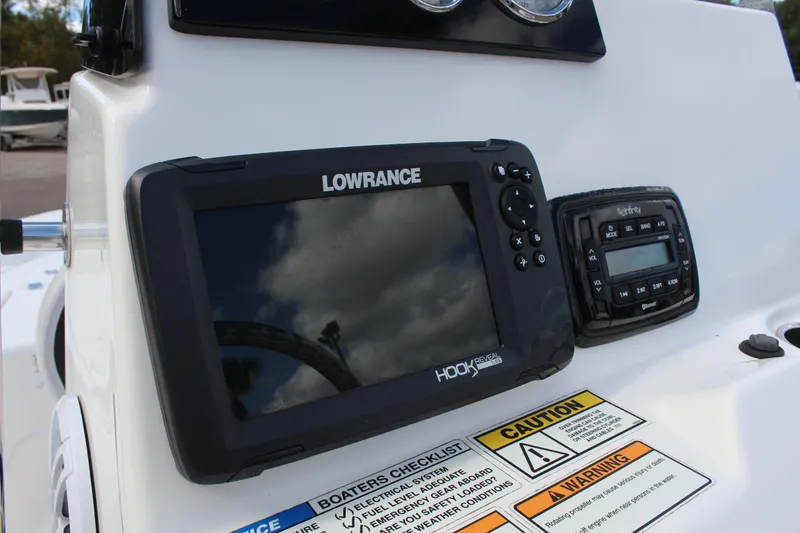 Slide: The Image of Lowrance navigation system on 2022 NauticStar 195 XTS boat dashboard. - 20