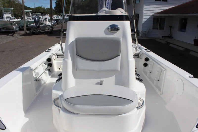 Slide: The Image of 2022 NauticStar 195 XTS boat interior with white and gray seating. - 21