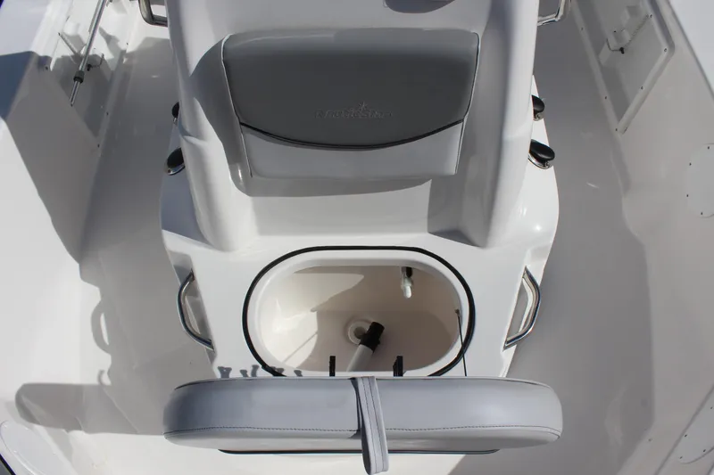 Slide: The Image of 2022 NauticStar 195 XTS boat interior with seating and storage compartment. - 22