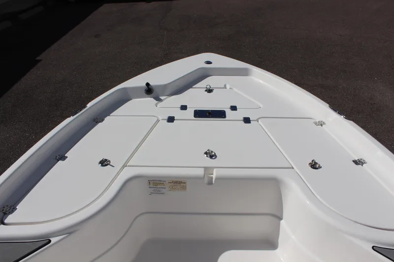 Slide: The Image of 2022 NauticStar 195 XTS boat deck with storage compartments. - 23