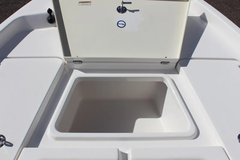 Slide: The Image of 2022 NauticStar 195 XTS boat storage compartment, open and empty. - 26