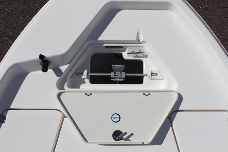 Slide: The Image of 2022 NauticStar 195 XTS boat storage compartment with latch and handle. - 27