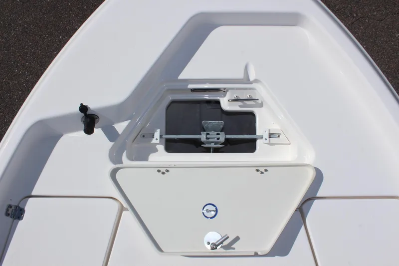 Slide: The Image of 2022 NauticStar 195 XTS boat deck with storage compartment and latch. - 28