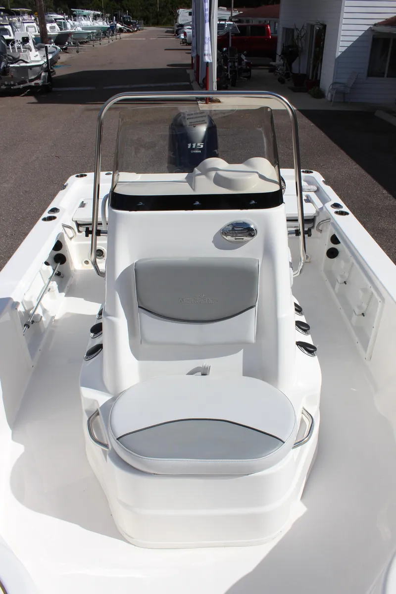 Slide: The Image of 2022 NauticStar 195 XTS boat interior with seating and console. - 29