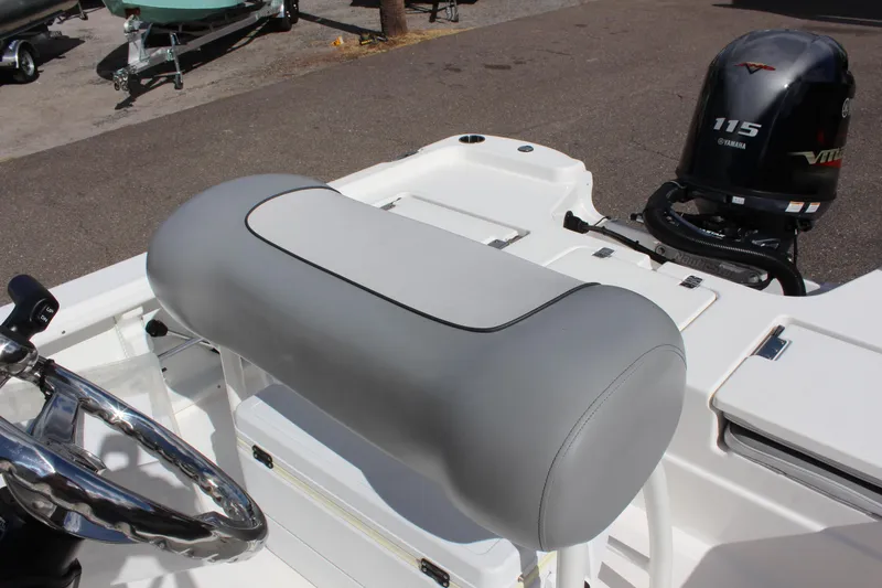 Slide: The Image of 2022 NauticStar 195 XTS boat interior with steering wheel and Yamaha 115 engine. - 30